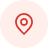 Red map pin icon centered on a light pink circular background, symbolizing location or destination. Simple and minimalist design.